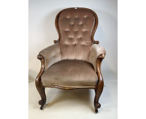 A Victorian button back open arm chair.W:70cm x D:67cm x H:108cm