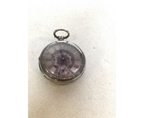 A silver pocket watch with a silver engine turned engraved dial highlighted in gold. Hallmarks to inside of case. An untested