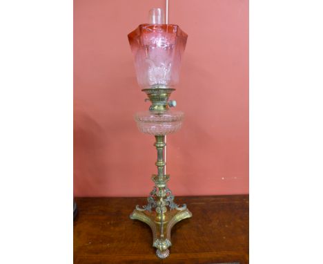 A Victorian brass oil lamp, with cut glass reservoir, Duplex burner by Evered