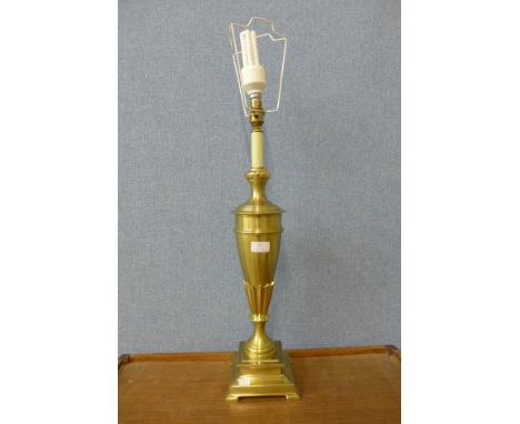 A brass urn shaped table lamp