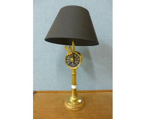 A brass steam gauge style table lamp