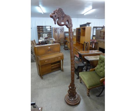 A mid 20th Century carved wood dragon standard lamp