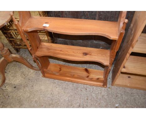 Wall mounted pine shelf with turned decoration