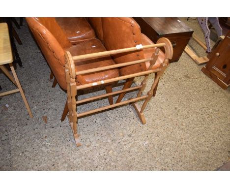 A light wood towel horse