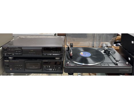 A Technics SL-PG570A Compact Disc Player together with a Technics RS-AZ6 Stereo Cassette Deck and a Audio Dynamics Corporatio