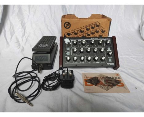 A Moog Minitaur Bass Synth and Moog Expression Pedal, this item comes with its original box (in poor condition), booklet and 