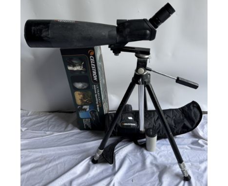 A Celestron Ultima 100ED spotting scope on a tripod with box and cover