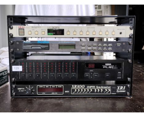 Various Audio and MIDI Utillities in a Stackable Rack Unit including an Akai ME 30P II Midi Programable Patch Bay, an Alesis 