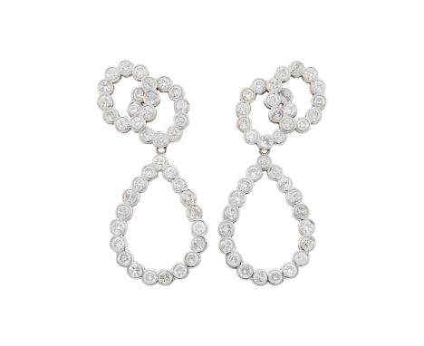 14 kt., 78 collet-set round diamonds ap. 5.85 cts., ap. 9.8 dwts.Diamonds: I-J-K-SI-Imperfect.Clip-backs. 2 1/8 x 15/16 inche