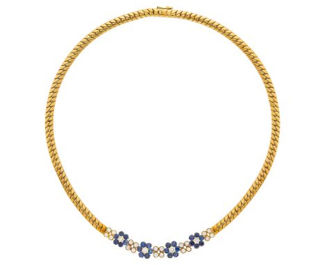 18 kt., four florets, 24 round sapphires ap. 3.90 cts., 24 round diamonds ap. 1.75 cts., signed Garrard, with maker's mark, a
