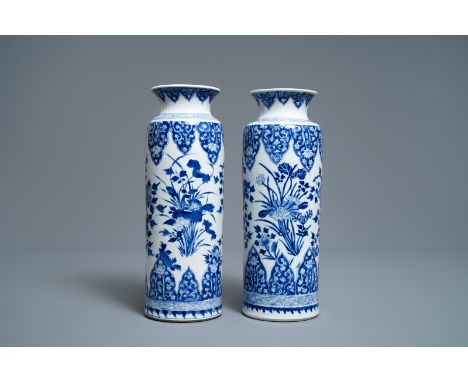 A pair of Chinese blue and white rouleau vases, Kangxi -- H.: 32 cm   ---   Condition reports, high resolution images or extr