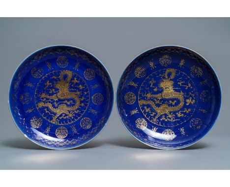 A pair of Chinese gilt-decorated blue-ground 'dragon' dishes, Guangxu mark and of the period -- Dia.: 34,5 cmÊ Condition: (UV