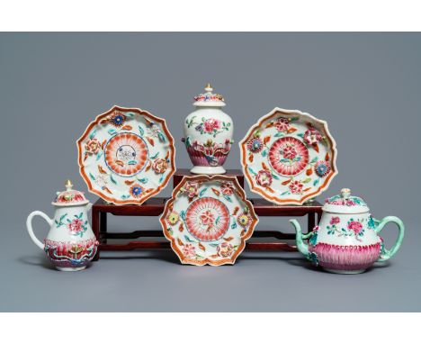 A Chinese famille rose relief-decorated teapot, milk jug and tea caddy on stands, Yongzheng -- L.: 14,5 cm (the stands) L.: 1