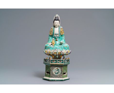 A Chinese verte biscuit group of Guanyin with child on a lotus throne, Kangxi -- H.: 42 cm  --  Condition reports, high resol