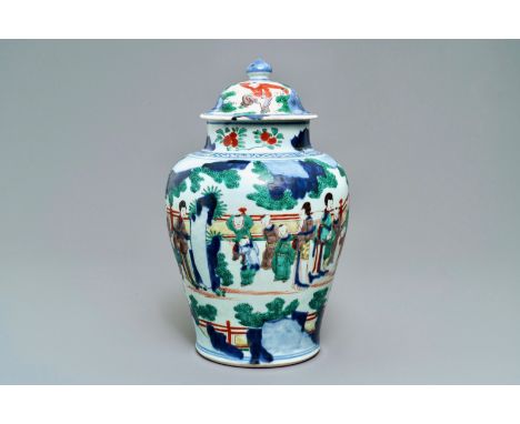 A Chinese wucai baluster vase and cover with playing boys, Transitional period -- H.: 41 cmÊ Condition: (UV-checked) - The co