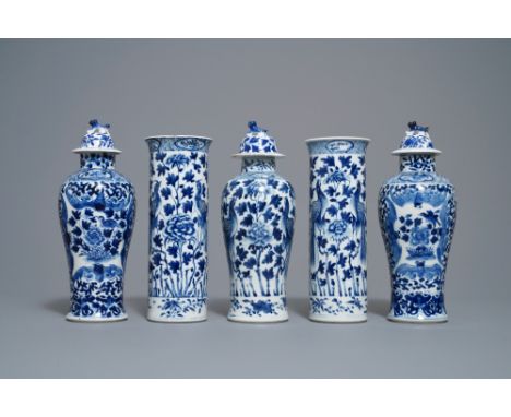 A Chinese blue and white five-piece garniture with peacocks, Kangxi mark, 19th C. -- H.: 28 cm (the tallest)  --  Condition r
