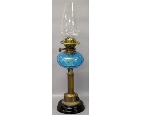 A Victorian oil lamp of column form with turquoise glass reservoir (Wright & Butler)