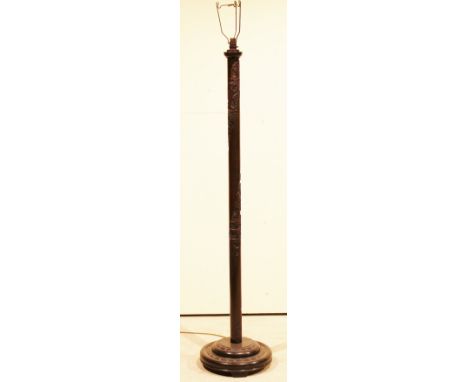 An early 20th Century Far Eastern carved wooden standard lamp (electrical collector's item)
