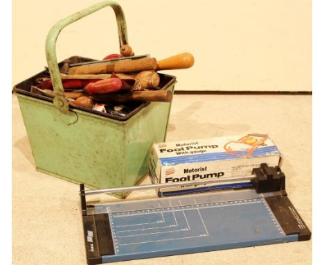 Tin containing assorted tools, a foot pump and a small guillotine
