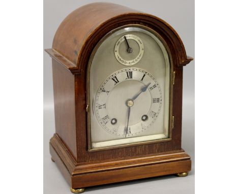 An Edwardian mahogany-cased Coventry mantel clock (lacks key)