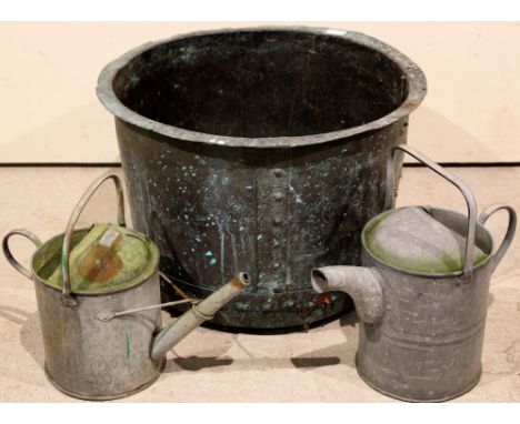 A riveted circular copper wash tub (for use as a planter - 60cm dia x 42cm h) & 2 metal watering cans