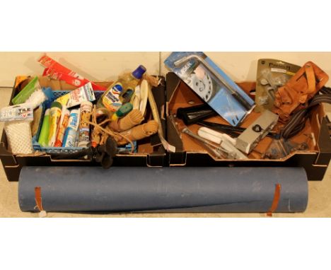 A roll of building paper (water resistant) together with mixed tools, unused door closer and decorating materials