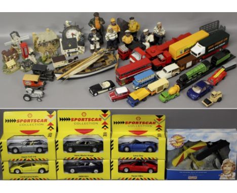 An assortment of toy trucks, buses, boxed cars, fisherman model collection and miniature houses including Leonardo collection