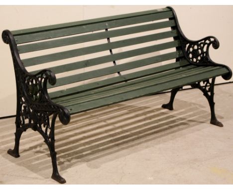 Garden bench with cast iron ends and wooden seat, 136cm.