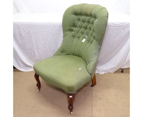 A Victorian button-back upholstered nursing chair, on cabriole legs 