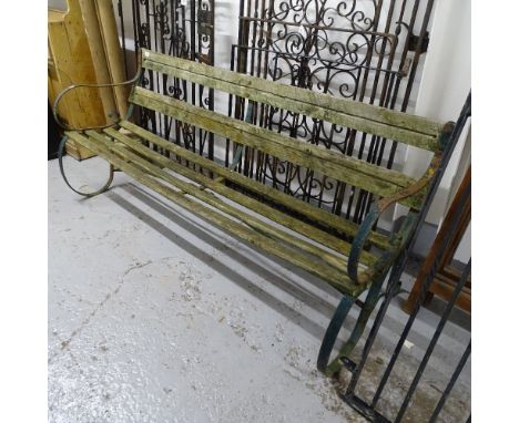 A Victorian scrolled wrought-iron garden bench, L177cm 