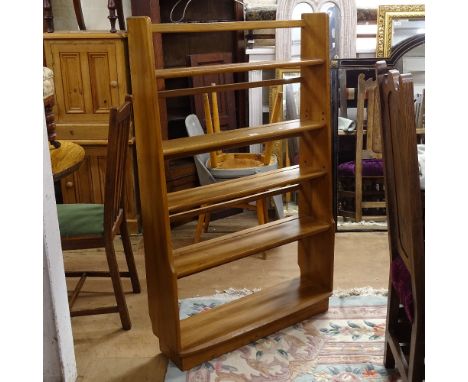 An Ercol Windsor elm graduated open bookcase, W120cm 