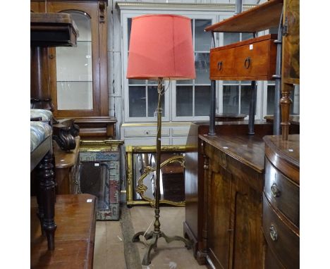 A brass telescopic standard lamp and shade 