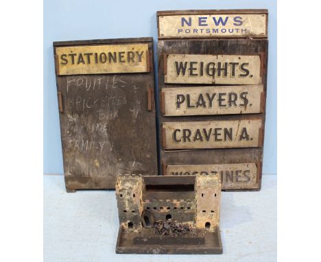A group of three wooden shop advertising signs from the Portsmouth area, including 'Portsmouth News' and 'Stationary' togethe