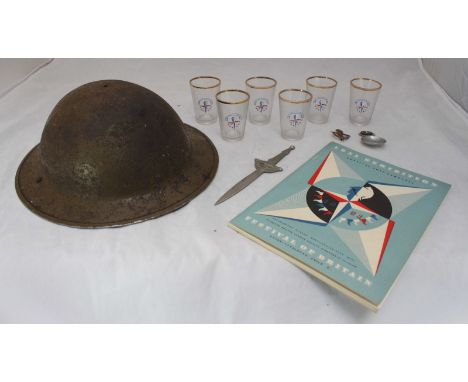 An assortment of Festival of Britain collectables including a set of six shot glasses, a 1951 exhibition programme and badges