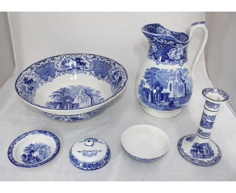 Four pieces of Abbey Blue and White ceramics, including a water jug and basin, a candlestick and a lidded soup dish, each wit