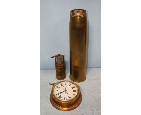A Smiths Astral brass bulkhead clock, together with a large converted brass shell case and a brass 'Oldham' davy lamp.
