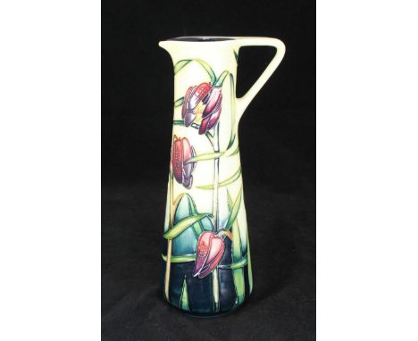 A Moorcroft ceramic 'Cricklade' pouring jug, designed by Rachel Bishop and signed Sian Leeper, in original box, 24cm high