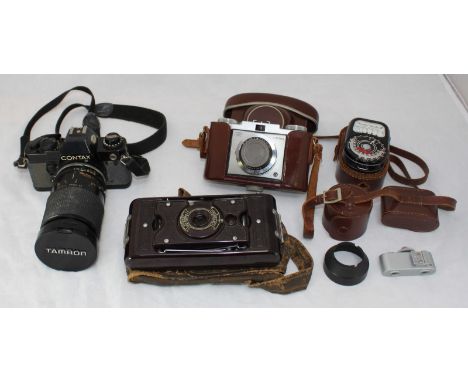 A Zeiss Ikon Contina camera with Novicar-Anastigmat  1:2,8 45mm lense, in original leather case with Weston Master III light 