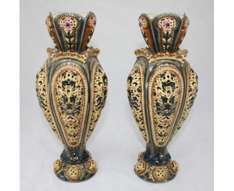 A pair of late 19th century Zsolnay Pecs Hungarian reticulated vases, the body pierced with scrolling foliage decoration, bot