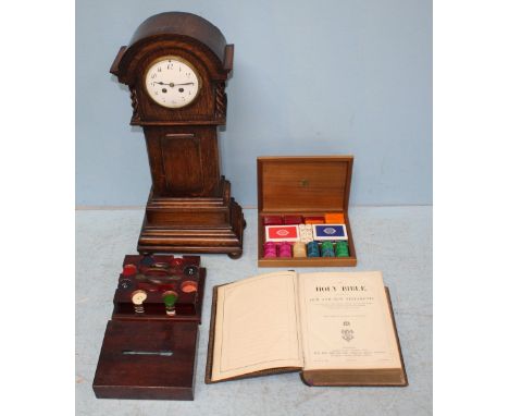 A small oak-cased grandmother clock with French movement striking a gong, Arabic numerals to the white dial, 64cm high, toget
