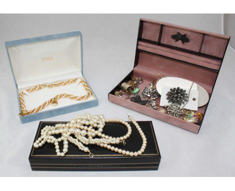 A selection of various costume jewellery, including a silver pendant with enamel dart board to front, two pearl necklaces, nu