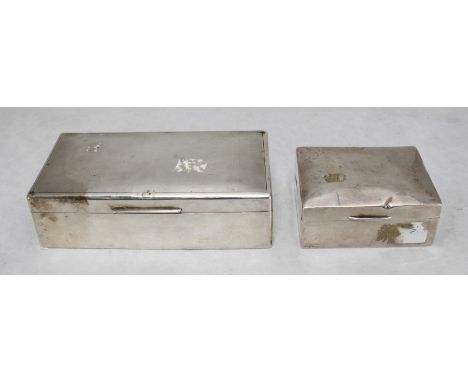 An early 20th century silver cigarette box of rectangular form with engine turned decoration, 18x9cm, together with a smaller