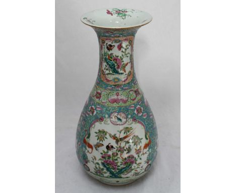 A late 19th/early 20th Century Canton enamel vase, painted with birds amidst flowers in polychrome enamels. 45cm high.