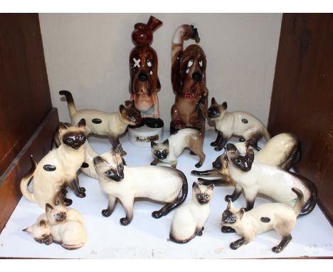SECTION 2. A collection of Eleven ceramic cat figures, including four made by Beswick, together with two Bond ware ceramic mu
