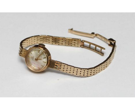A 9ct gold ladies cocktail watch by Tissot on gold strap, the dial with batons denoting hours, total weight approximately 16.