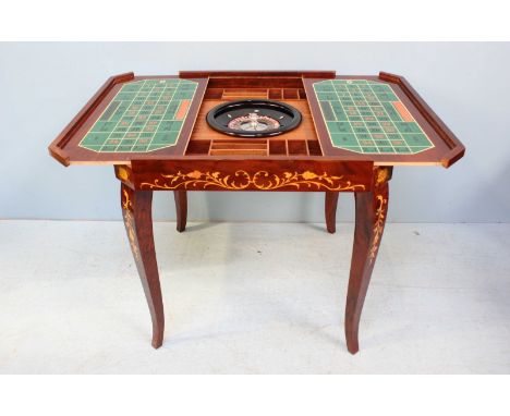 A 20th century Sorrento marquetry inlaid mahogany four-in-one games table, the top lifting off to reveal a backgammon board t