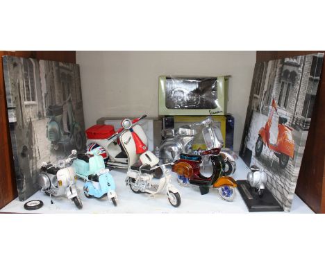 SECTION 5. A quantity of model scooters including Vespa's and Lambretta's, together with two canvas prints of Vespa's. Proven