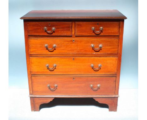 An Edwardian inlaid stained walnut chest of two short, over three long graduated drawers, with brass handles and raised on sh
