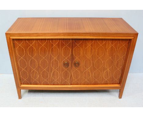 A 1950's sapele mahogany Gordon Russell Helix sideboard, designed by David Booth and Judith Ledeboer, the cupboard doors with