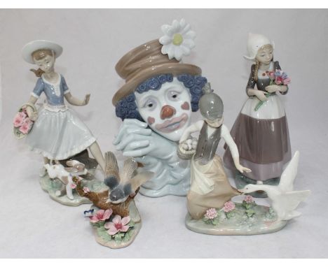 Five various Lladro ceramic figures, including a clown and a bird among others, all complete with original boxes.